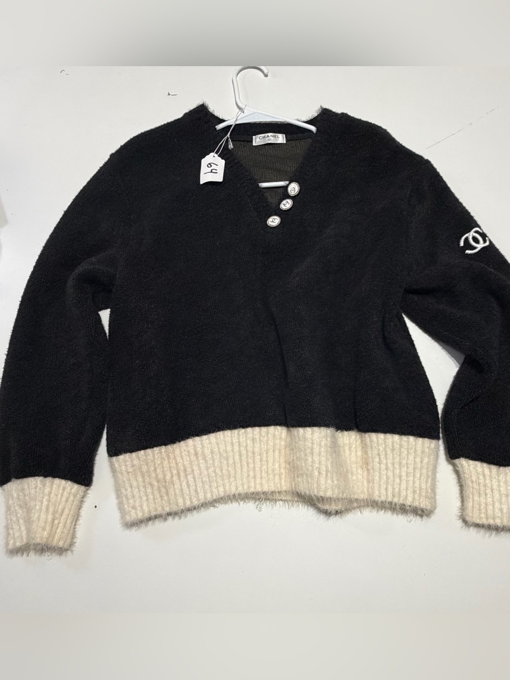 CHANEL Black V‑Neck Sweater with Cream Rib Hem
